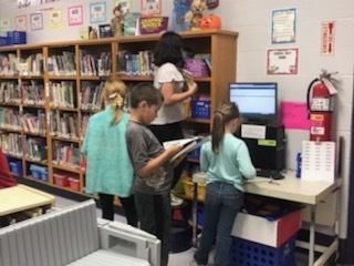 Students checking out books